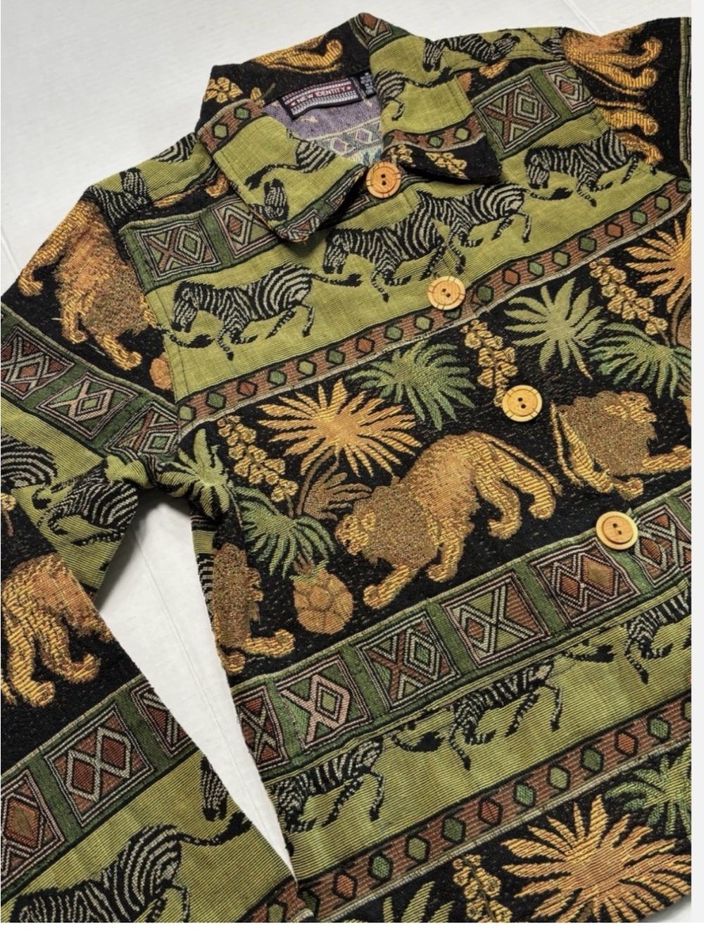 Vintage 1990s New Identity tapestry jacket featuring a safari animal print SizeL